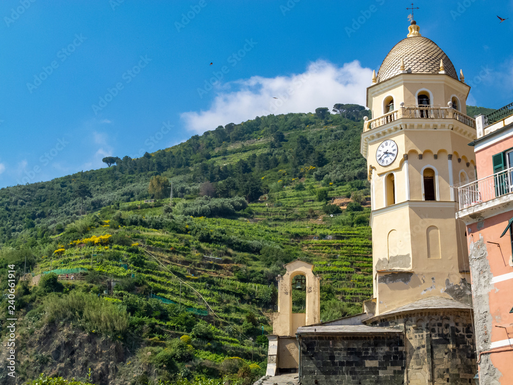 Beautiful summer view of the bell tower of Church of Santa Margherita d'Antiochia in Vernazza, Cinque Terre, Italy