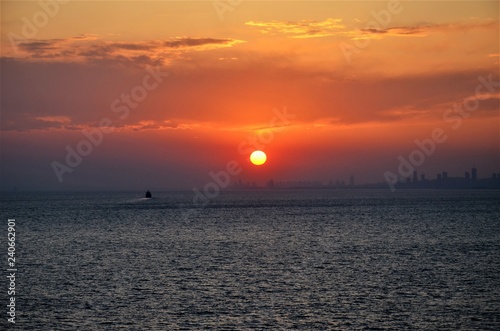 Sunset over the ocean © Mariusz
