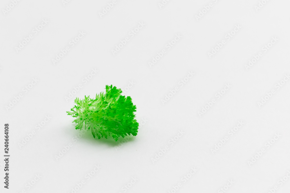 Fototapeta premium Green grown crystals on white paper