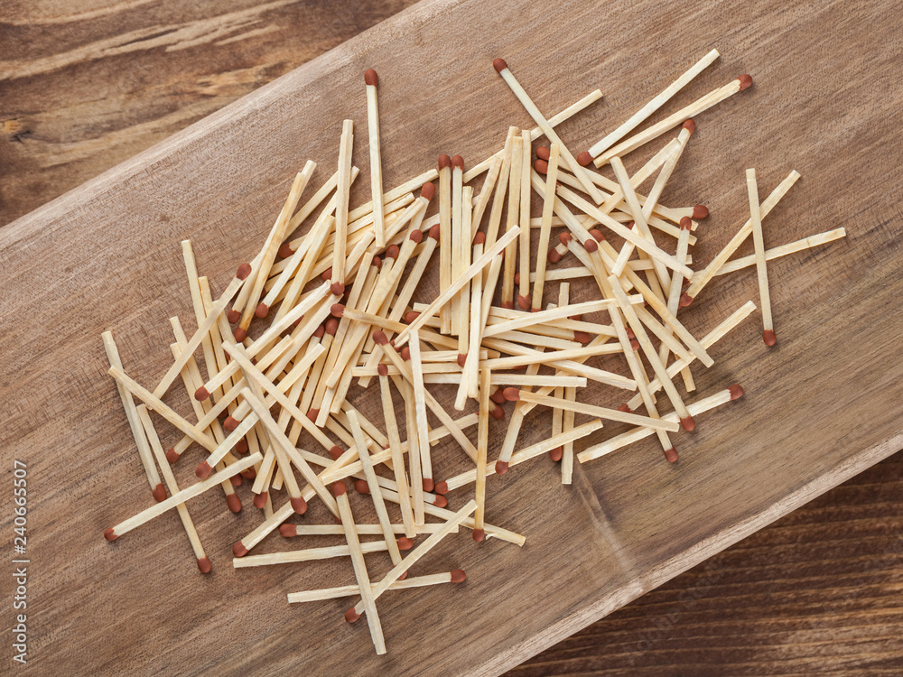Wooden matches sticks on a wooden table background