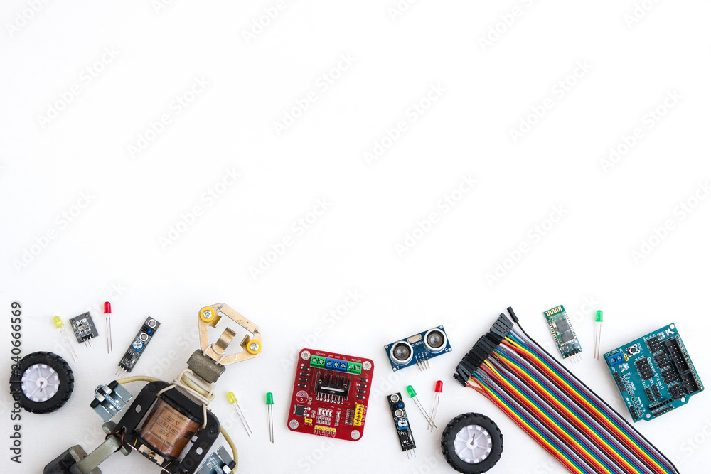 A metal robot and an electronic board that can be programmed. Robotics and electronics. DIY robotics. Mathematics, engineering, science, technology, computer code. STEM and STEAM education for kids. A metal robot and an electronic board that can be programmed. Robotics and electronics. DIY robotics. Mathematics, engineering, science, technology, computer code. STEM and STEAM education for kids.