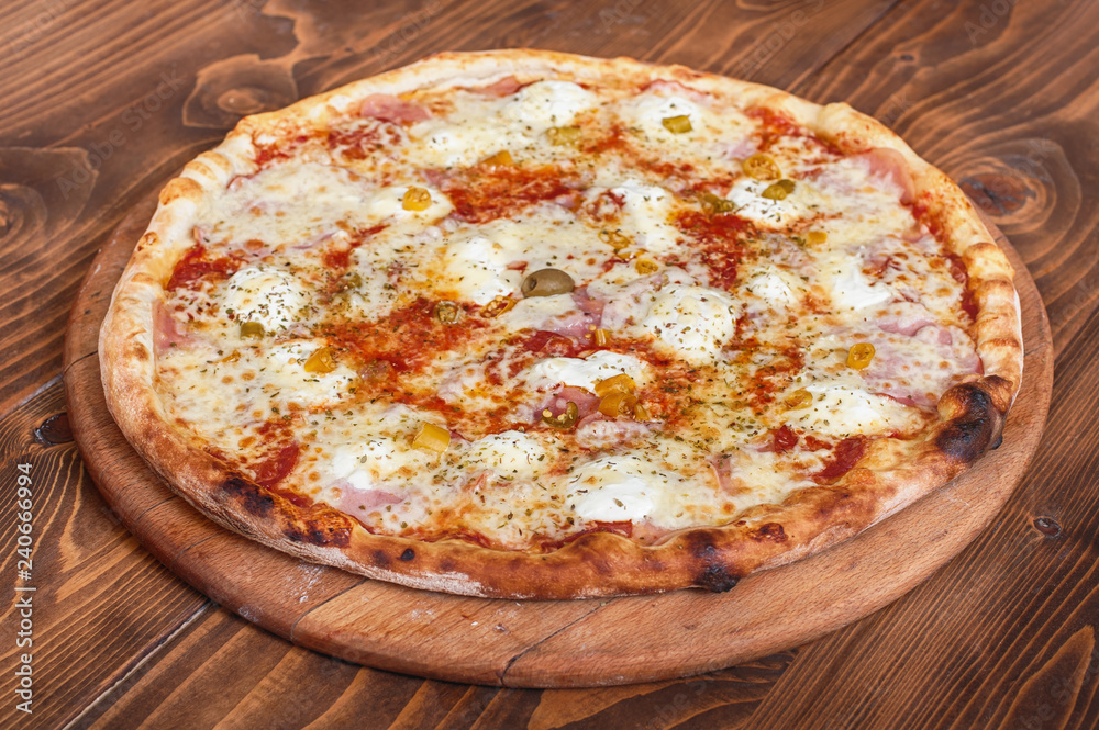 Pizza margherita on wooden background, side view