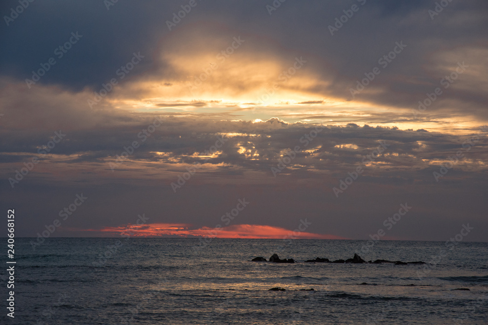 Dramatic clouds with the setting sun near Punta de Mita, Bucerias, Mexico