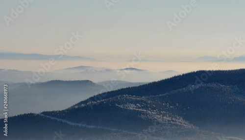 view of mountains in fog
