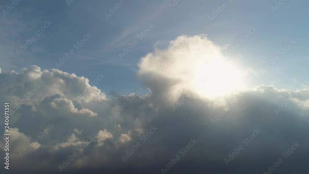 aerial view sky with clouds and sun rays. cloudscape view over white fluffy clouds. aerial landscape aerial view sky with clouds and sun rays. cloudscape view over white fluffy clouds. aerial landscape