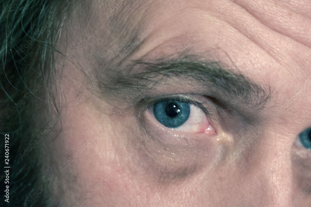 Close-up Shot Of Man's Eye. Man With Blue Eyes. Stock Photo