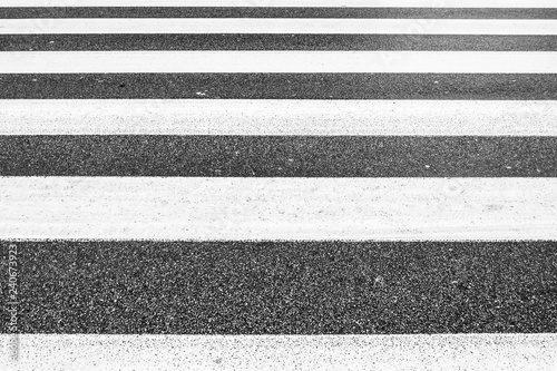 symmetry of monochromatic parallel lines of crosswalk, asphalt rough pattern, no people