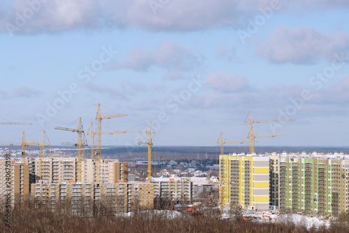 view of houses under construction in winter