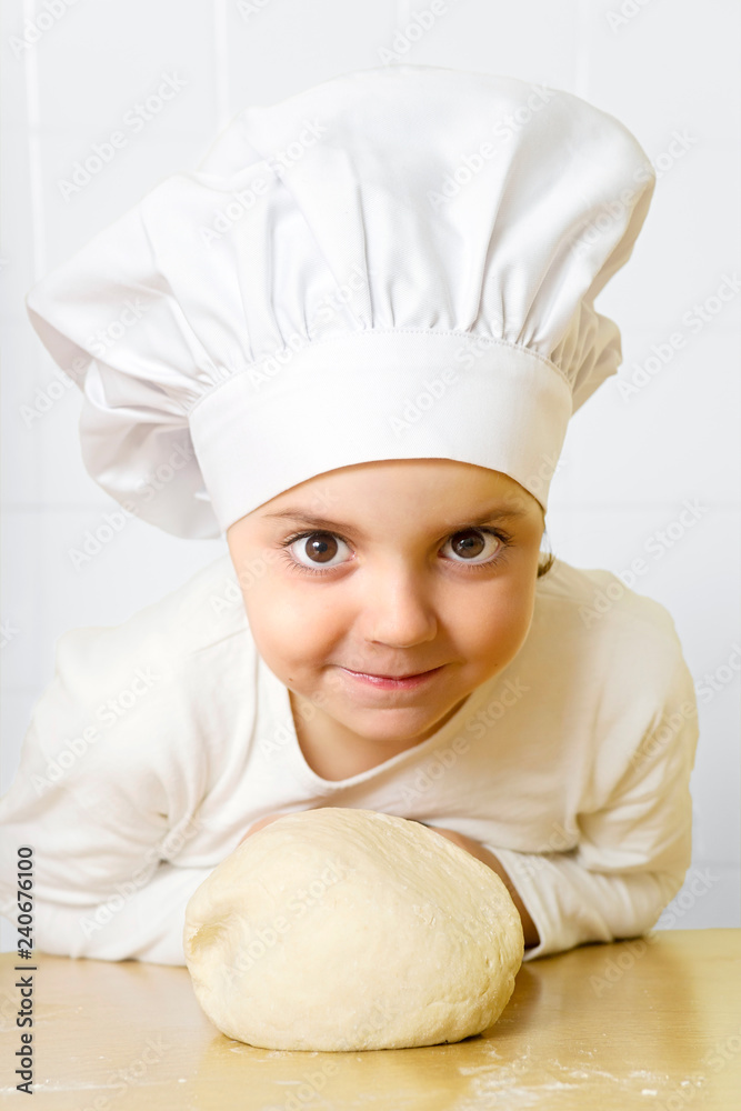 funny happy caucasian girl preparing flour dough to baking in kitchen funny happy caucasian girl preparing flour dough to baking in kitchen