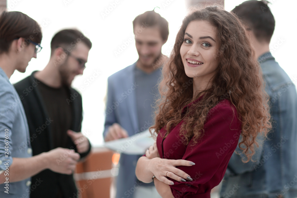 young business woman on the background of the employees. young business woman on the background of the employees.