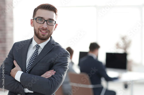 successful businessman on background of office