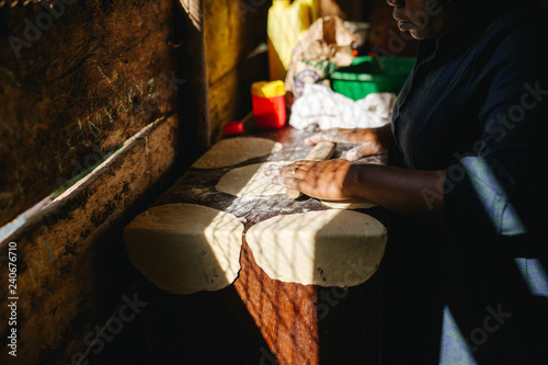 woman preparing food in Uganda, Africa