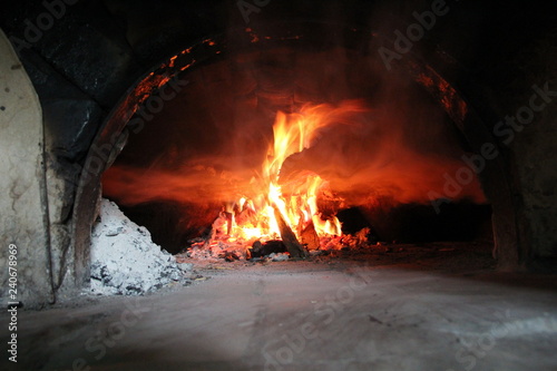 Fire wood brighly burning in furnace. Fire and flames photo