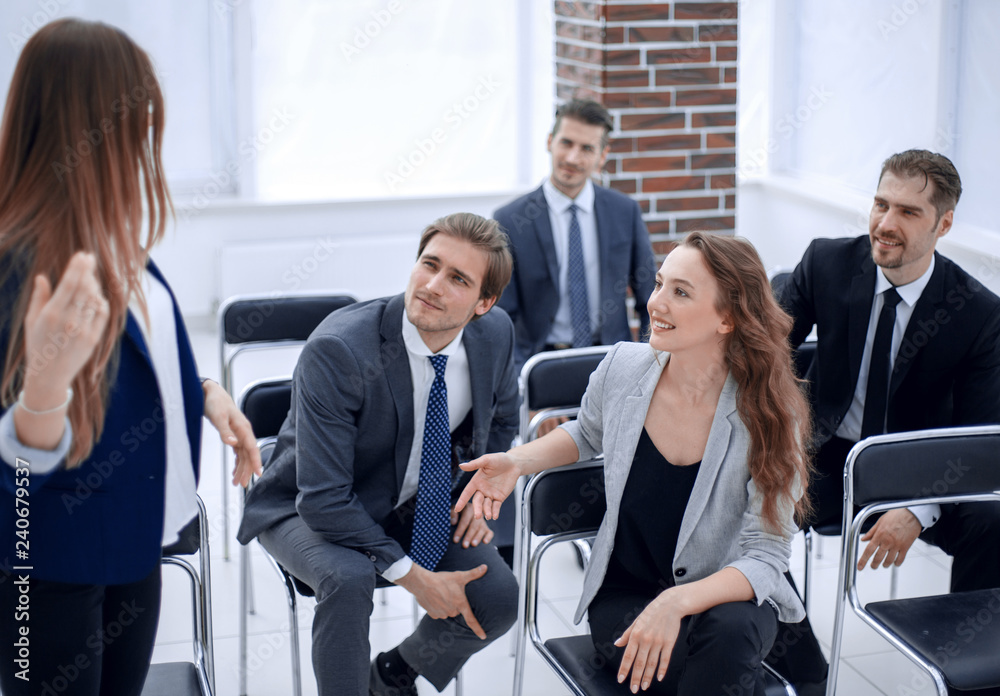 team at office meeting, friendly executive discussing good news team at office meeting, friendly executive discussing good news