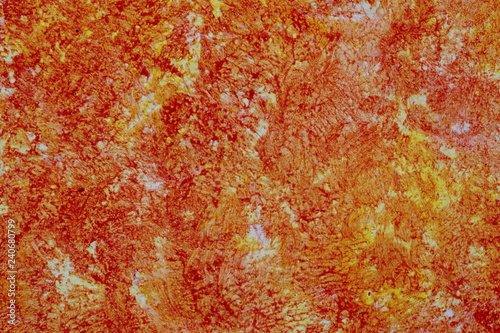 Yellow-orange wall decorated texture in the Mediterranean style.