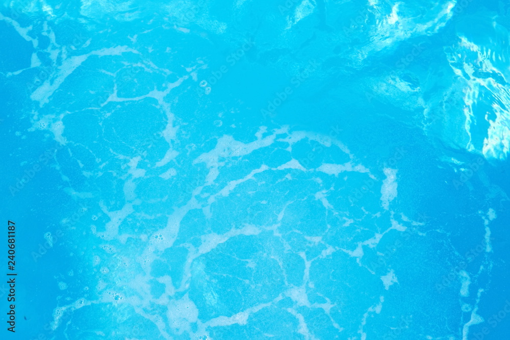  Rippled pattern of blue clean water in a  swimming pool.