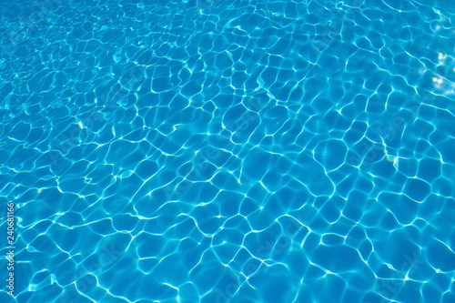  Rippled pattern of blue clean water in a  swimming pool.