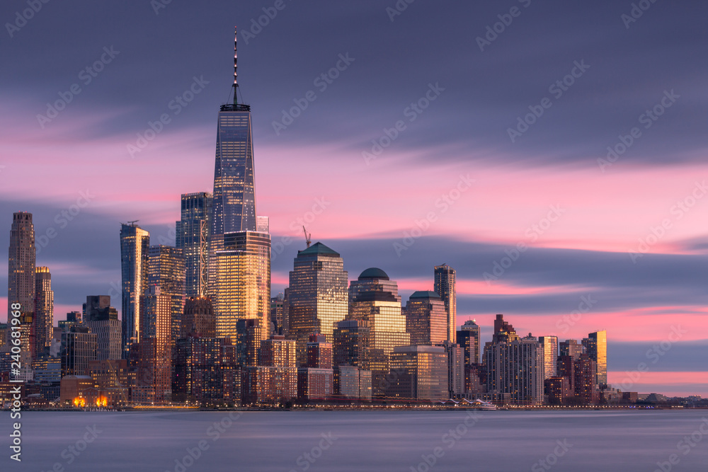 Financial district  view from hudson river at sunset with long exposure