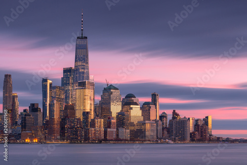 Financial district view from hudson river at sunset with long exposure