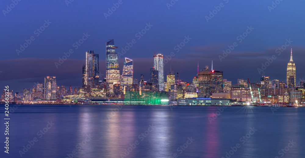 Midtown Manhattan Panoramic view at night from Hudson river with long exposure
