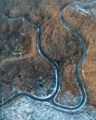 view of curvy road in Mecsek forest at winter