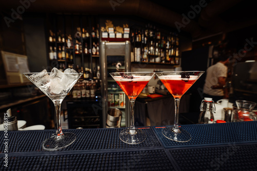 Ready red cocktail in a glass at the bar.