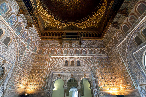Beautiful interior of the 14th century Alcazar royal palace in Mudejar architecture style with patterned walls, Seville