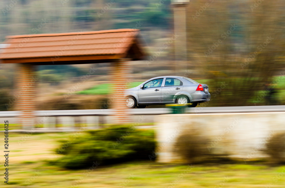 automobile moving at high speed by rural road automobile moving at high speed by rural road