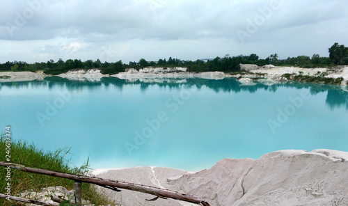 Kaolin Lake. The man-made lake, turned from a mining ground holes, is located in Air Raya Village, Tanjung Pandan, Belitung Island, Indonesia. photo