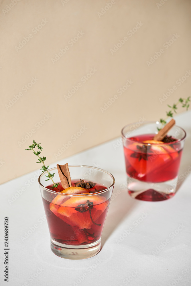 Christmas or Thanksgiving drink. Autumn and winter cocktail - grog, hot sangria, mulled wine with tea, lemon, rome, cinnamon, anise and other spices. Christmas or Thanksgiving drink. Autumn and winter cocktail - grog, hot sangria, mulled wine with tea, lemon, rome, cinnamon, anise and other spices.