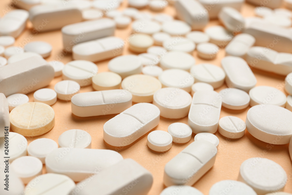 Many different pills on color background Many different pills on color background
