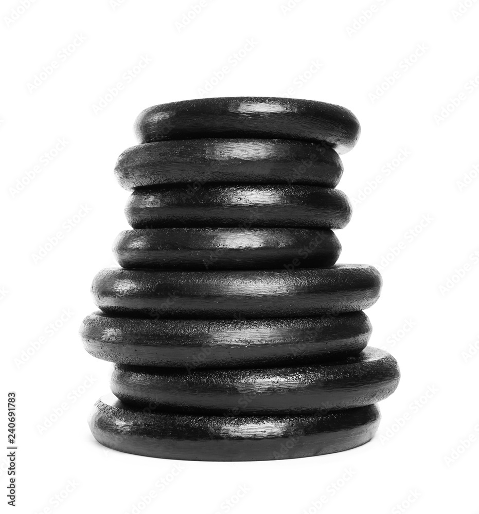 Many different weight plates on white background. Sporting equipment Many different weight plates on white background. Sporting equipment