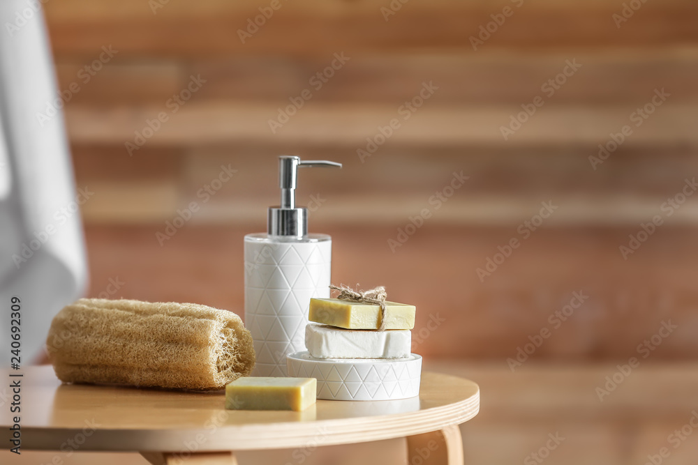Composition with soap and toiletries on table against blurred background. Space for text - obrazy, fototapety, plakaty 