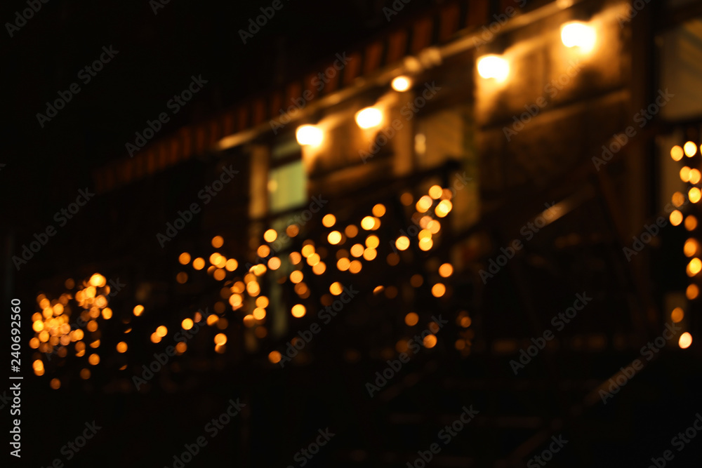 Obraz premium Beautiful street lights at night. Bokeh effect
