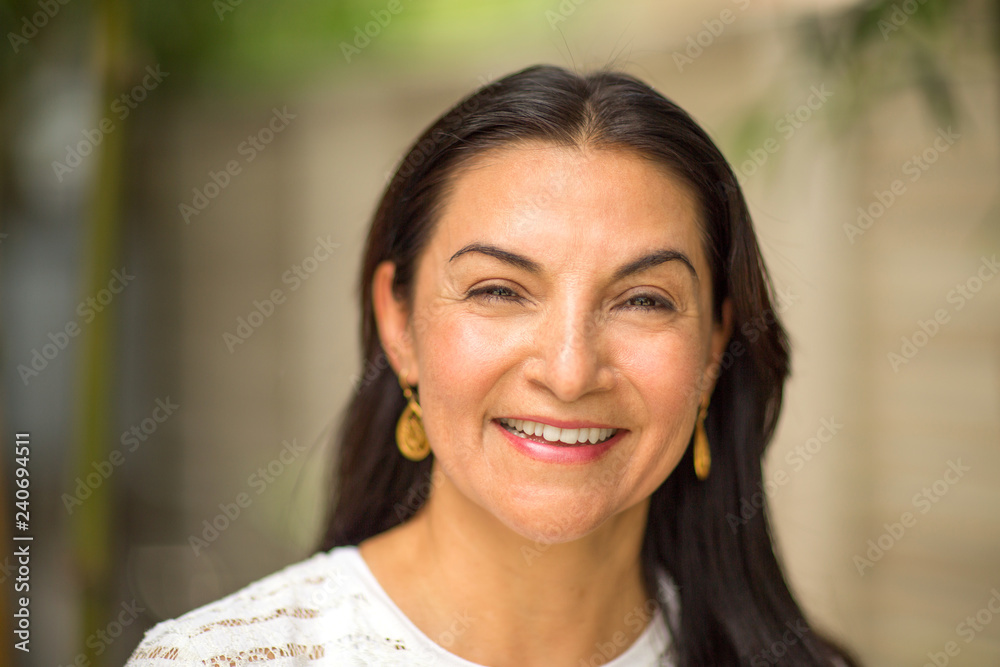 Portarit of a happy middle age Hispanic woman. Portarit of a happy middle age Hispanic woman.