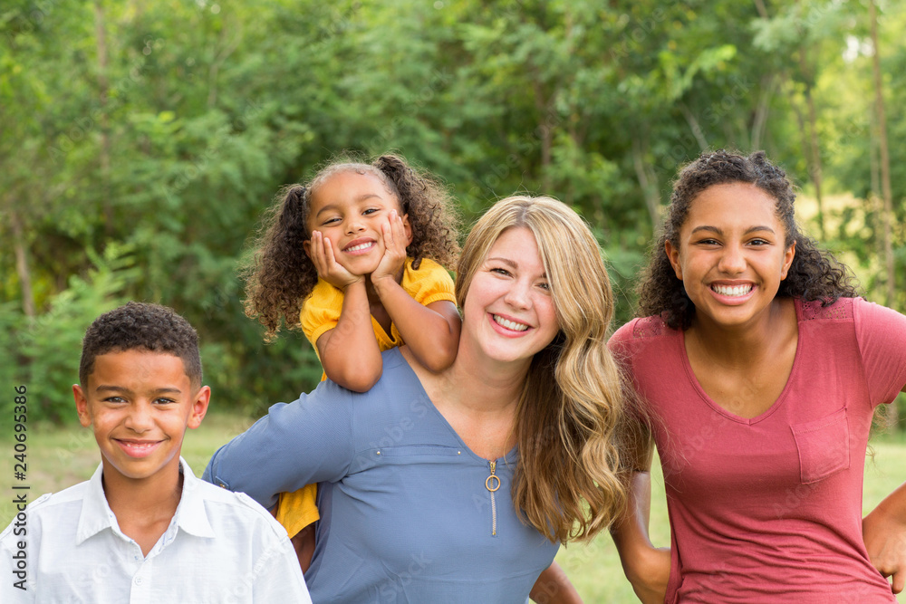 Portarit of a happy mixed race family smiling Portarit of a happy mixed race family smiling