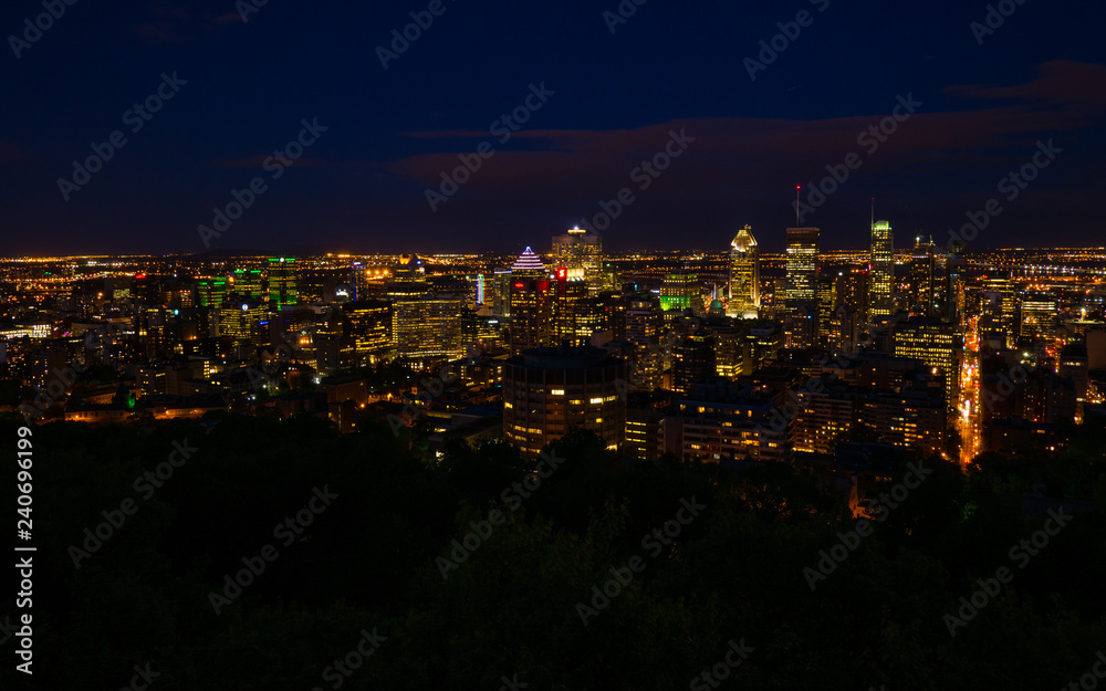 Wide view of downtown Montreal at night. Taken from the lookout on Mont Royal.