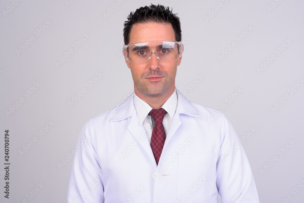 Portrait of handsome man doctor wearing protective glasses Portrait of handsome man doctor wearing protective glasses