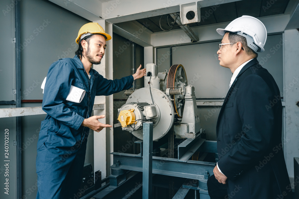 Asian engineers standing and smile to camera.. Asian engineers standing and smile to camera..