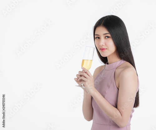 Confident woman posing with champagne glass.