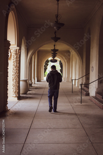 man walking in corridor