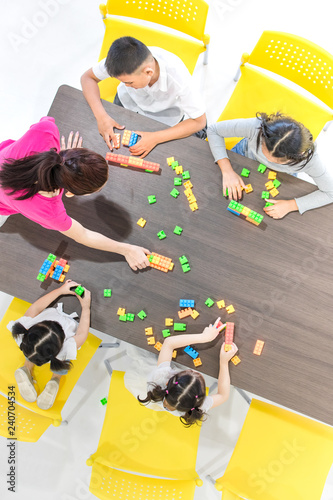 Kids playing colorful toys.