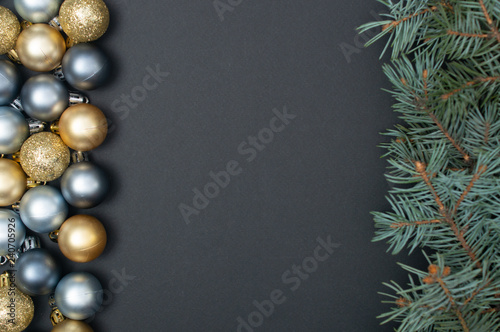 Creative pattern with Christmas tree branches, silver and gold baubles. Concept