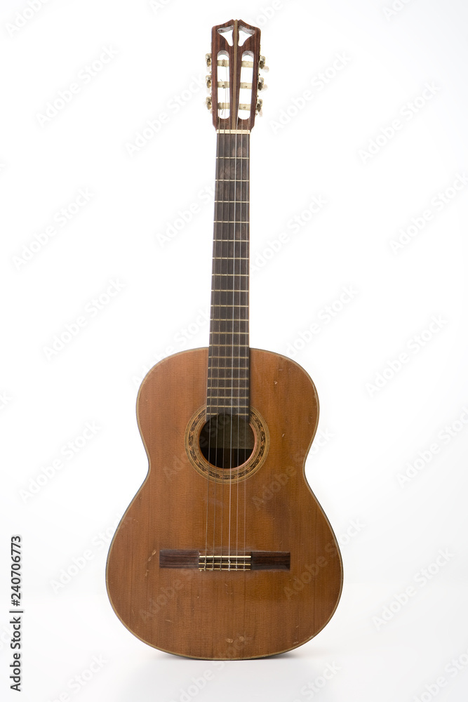Old guitar on white background