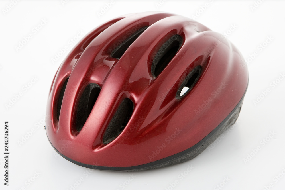 a red bicycle helmet on a white background