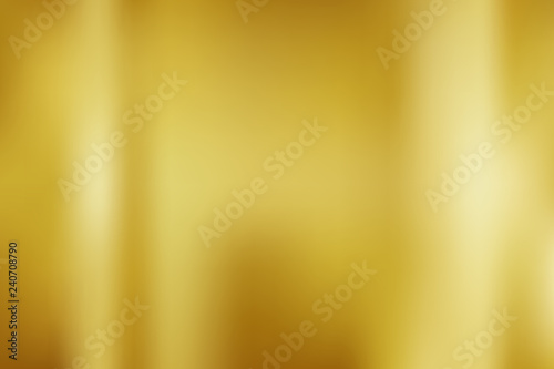 Abstract gold gredient metal color theme satin texture background. Lighting effects of flash. Blurred vector background with light glare.