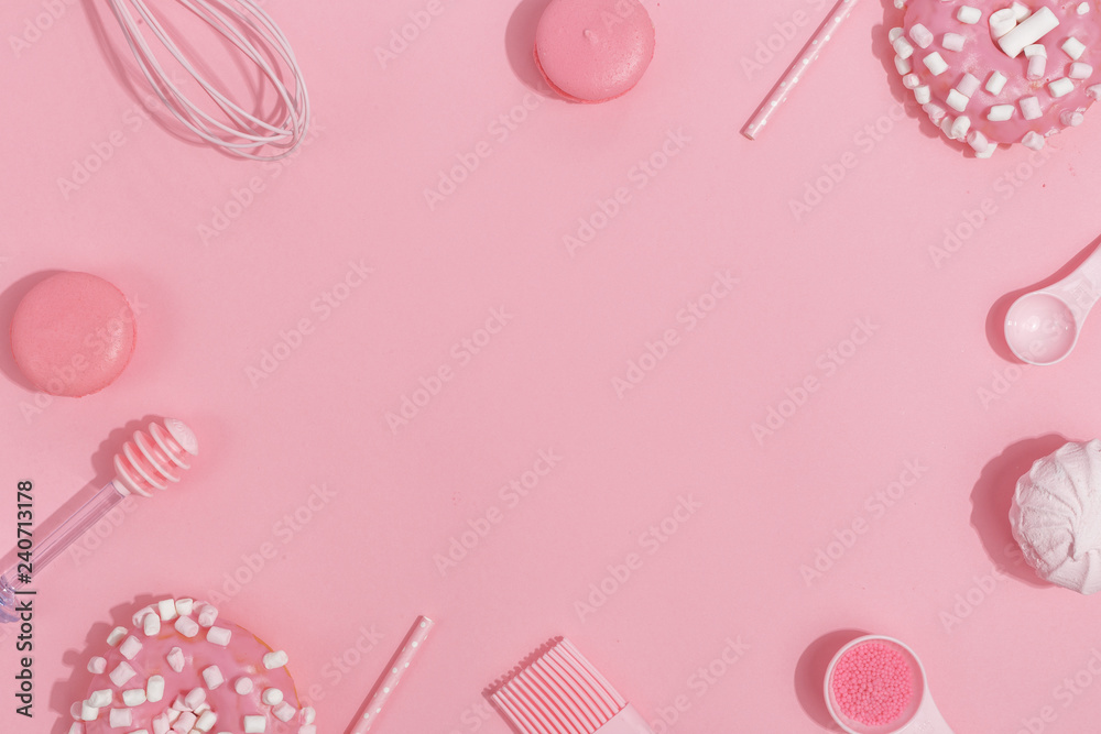 Kitchenware and tools, pastry and sweets on a pink background. Top view. Copy space. Kitchenware and tools, pastry and sweets on a pink background. Top view. Copy space.