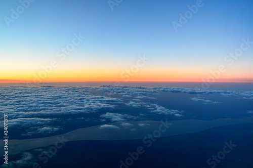 above the clouds, a beautiful dawn at an altitude of 10,000 meters, the Volga River
