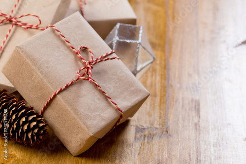 craft christmas presents on wooden background.