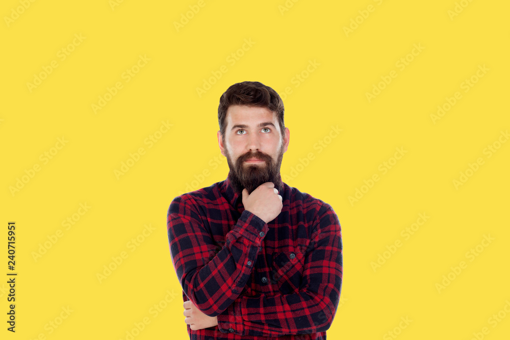 Hipster man with big beard on a yellow background Hipster man with big beard on a yellow background